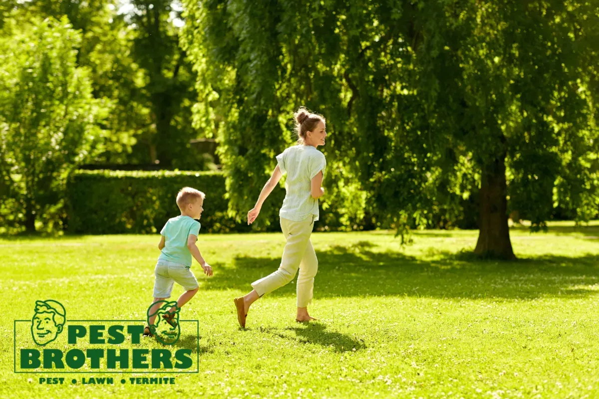 What Are the Benefits of Professional Lawn Care Compared to DIY Lawn Maintenance 3 mother and son in lawn